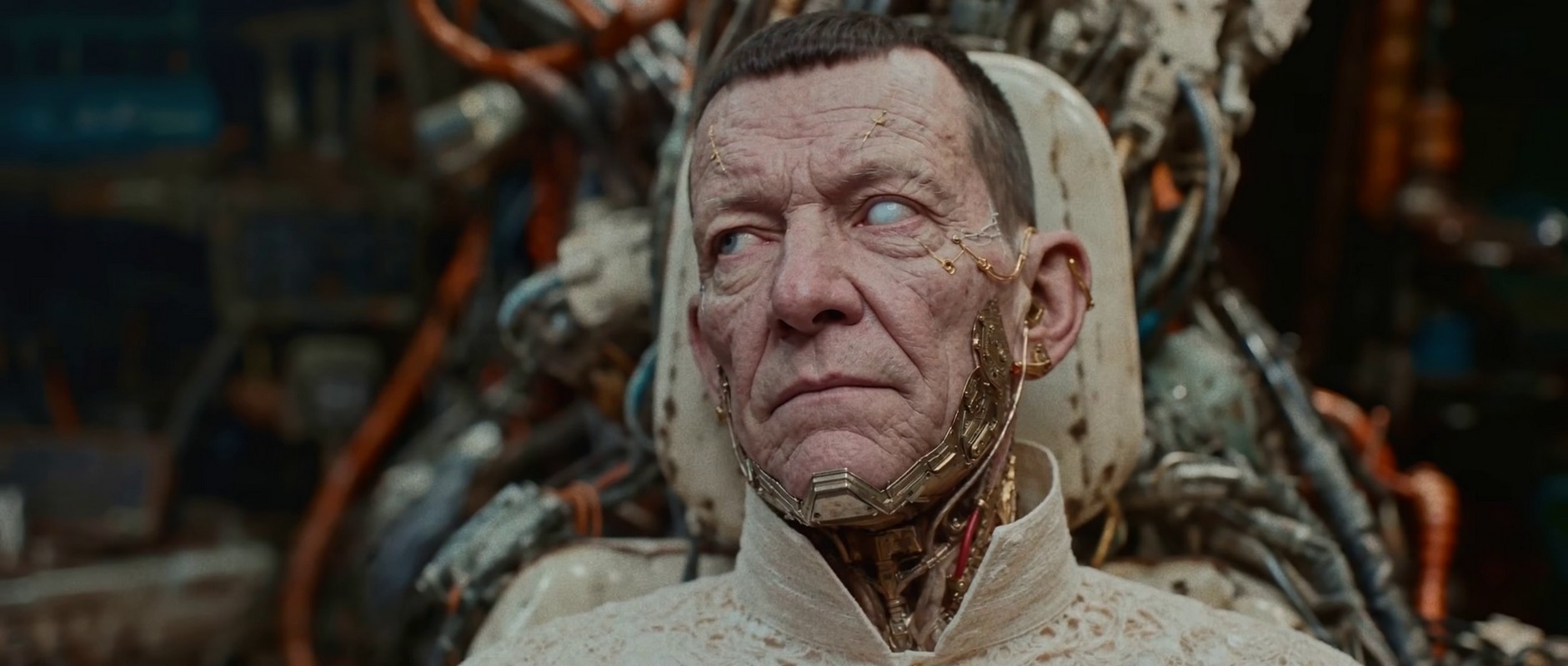 Close-up of a man with cybernetic implants.